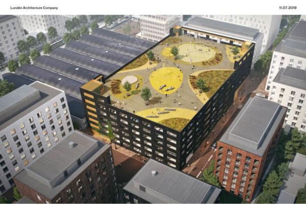 Visionsbild av parkeringshuset där man ser fritidsområdet på taket.