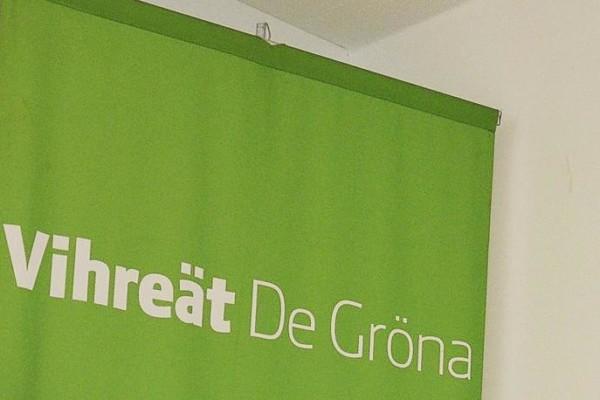Grönt plakat med texten Vihreät De Gröna