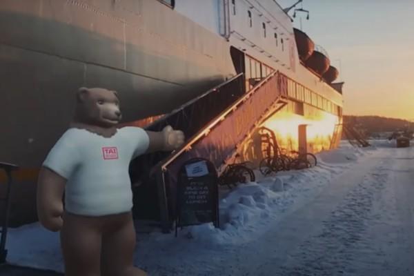 Animerad björn står vid fartyg